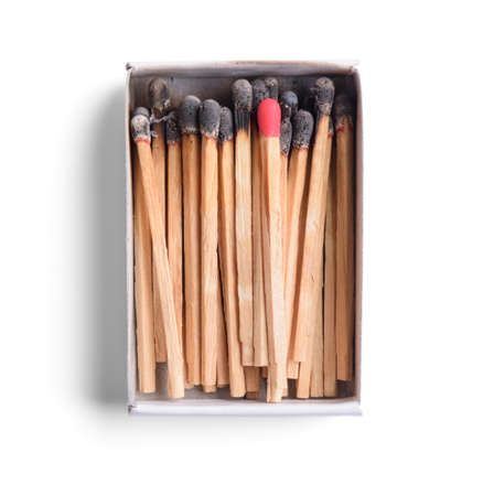 Top view of opened match boxes with burned matchsticks. Isolated on white backgroundの写真素材