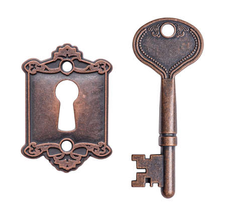Old key and keyhole isolated on white backgroundの写真素材