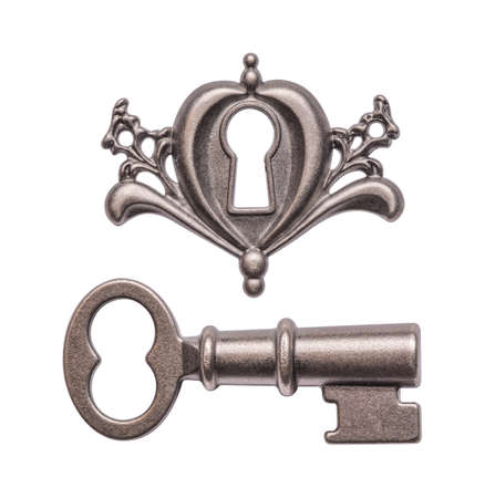 Old key and keyhole isolated on white backgroundの写真素材