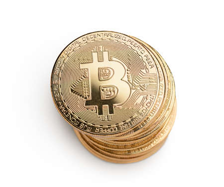 Macro shot of crypto currency gold Bitcoin coins. Isolated on white backgroundの写真素材