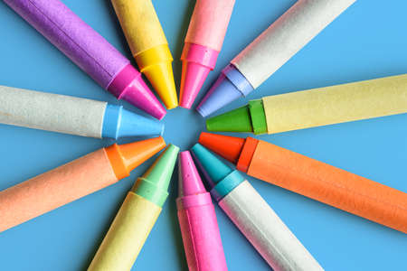 Close up of colorful pastel crayons on blue backgroundの写真素材