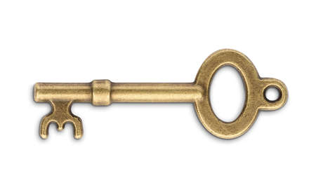 Vintage golden skeleton key isolated on white backgroundの写真素材
