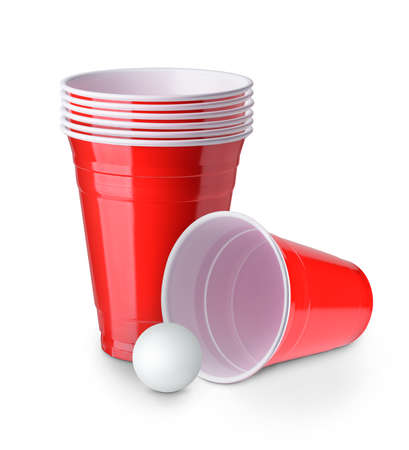 Beer pong. Red plastic cups and table tennis ball isolated on white backgroundの写真素材