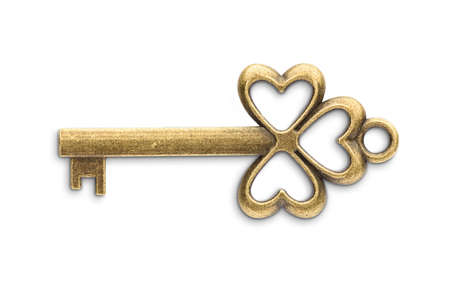 Vintage golden skeleton key isolated on white backgroundの写真素材