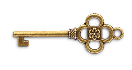 Vintage golden skeleton key isolated on white backgroundの写真素材