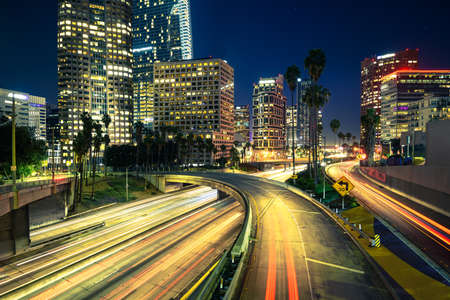 Downtown Los Angeles at night with car traffic light trailsの写真素材