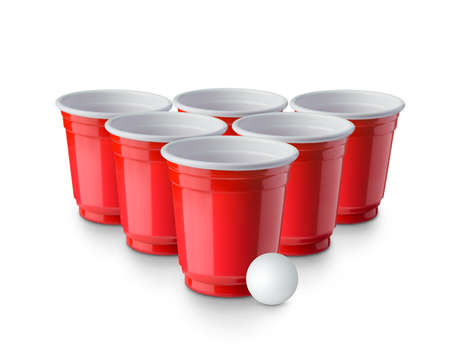 Red Beer Pong plastic cups with ball isolated on white background. Traditional drinking gameの写真素材