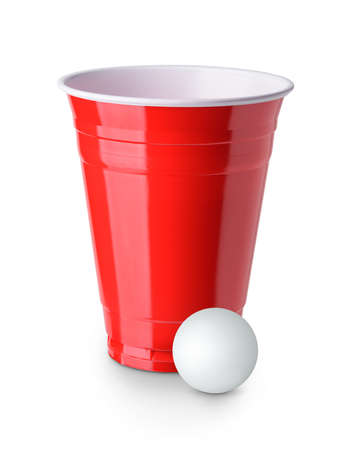 Beer pong. Red plastic cup and table tennis ball isolated on white backgroundの写真素材