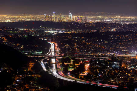 Traffic in downtown Los Angeles, California at nightの写真素材
