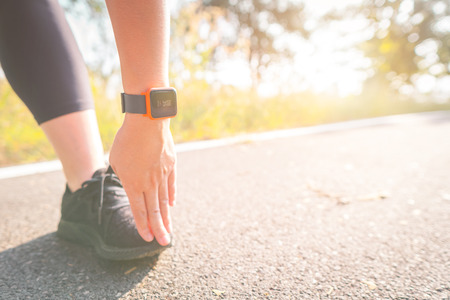 Women exercise in the morning with SmartWatch.の写真素材