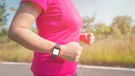 Women exercise in the morning with SmartWatch.の写真素材