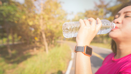 Women exercise in the morning with SmartWatch.の写真素材