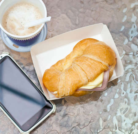 Ham cheese croissant placed on the table の写真素材