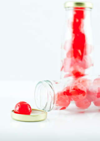 Glass of cherry compote on a white backgroundの写真素材