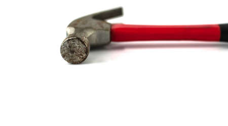 Old red hammer under the white backgroundの写真素材