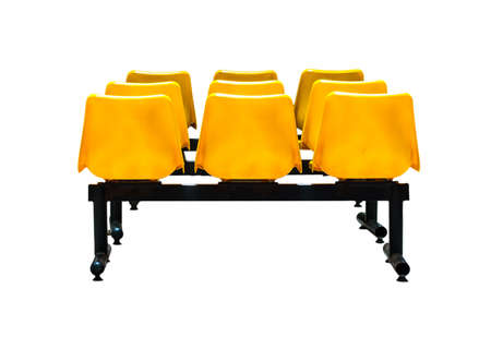 Yellow plastic chairs isolated on white backgroundの写真素材