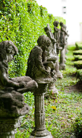 Statue of a little boy in the parkの写真素材