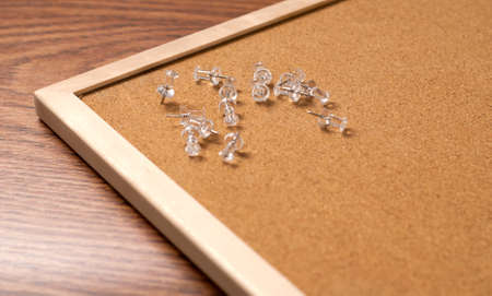 push pins on cork bulletin board の写真素材
