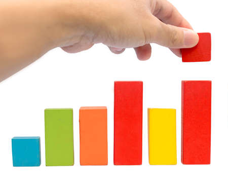 Colorful toy blocks on white background  forming a graph 