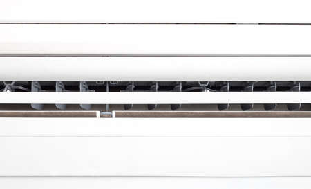 Closeup white air conditioner in roomの写真素材