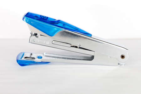 Blue stapler on isolated background