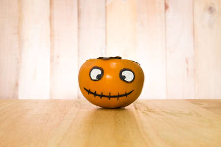persimmon ghost of Halloween,halloween concept background.の写真素材