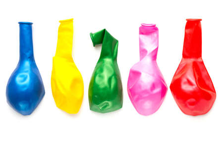 uninflated colorful party balloons on a white background. Multi-colored balloons for New Year, Birthday, Christmasの写真素材