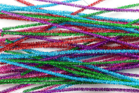 The colorful multicolor of tinsel for a background.multicolored New Year's tinsel isolated on white...
