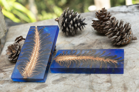 casting epoxy resin Stabilizing pine cone red blue abstract art blur background, Texture of a wooden...