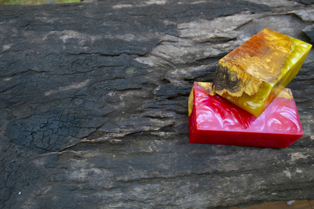 casting epoxy resin Stabilizing Afzelia burl exotic wood red yellow background, Abstract art picture photo, print design and your advertisement, hybridの写真素材
