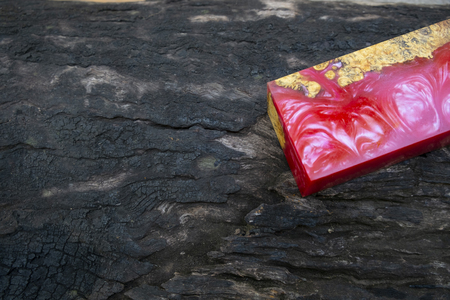 casting epoxy resin Stabilizing Afzelia burl exotic wood red yellow background, Abstract art picture photo, print design and your advertisement, hybridの写真素材