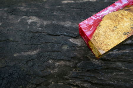 casting epoxy resin Stabilizing Afzelia burl exotic wood red yellow background, Abstract art picture photo, print design and your advertisement, hybridの写真素材