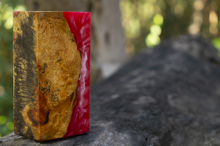 casting epoxy resin Stabilizing Afzelia burl exotic wood red yellow background, Abstract art picture photo, print design and your advertisement, hybridの写真素材