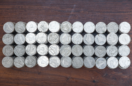 Lots stack coins on wooden desk background texture, Money for business planning investment and...