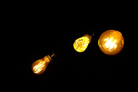 Classic retro incandescent led electric lamp on black background,Vintage light bulbの写真素材