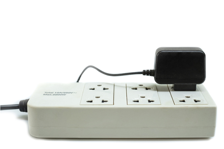 Multi socket with connected power Strip with a bunch of plugs on white background
