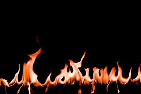 Fire flames on Abstract art black background, Burning red hot sparks rise, Fiery orange glowing...