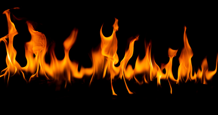 Fire flames on Abstract art black background, Burning red hot sparks rise, Fiery orange glowing flying particlesの写真素材