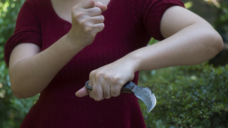 Knife in the hands, karambit knife tactical fighter, self defense Martial Arts Fighting