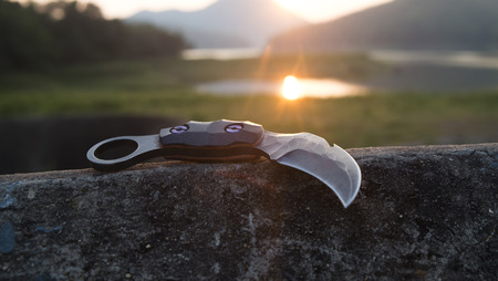 Knife in the hands, karambit knife tactical fighter, self defense Martial Arts Fightingの写真素材