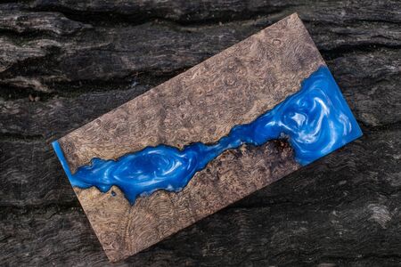 Casting epoxy resin Stabilizing persimmon burl wood abstract art backgroundの写真素材