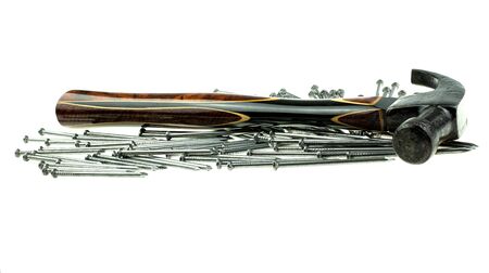 Old traditional curved claw hammer and nail on white background