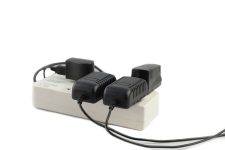 Multiple socket with connected power Strip with a bunch of plugs and adapter on white backgroundの写真素材