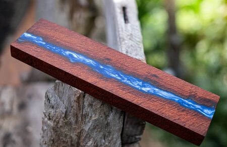 Casting resin wood has tiger stripe or curly stripe grain, wooden exotic beautiful pattern for crafts or abstract background textureの写真素材