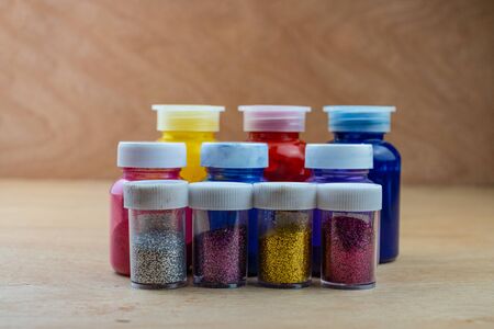 Mixing color epoxy resin in plastic cup for casting Stabilizing wood and pine cone hybrid