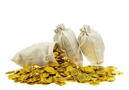 Stacking gold coin in treasure sack on white backgroundの写真素材