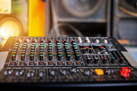 Audio sound mixer analog at the sound control room on blurred background