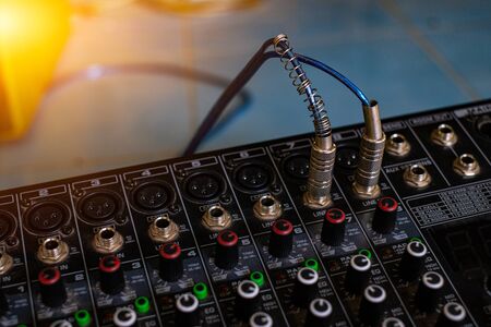 Audio sound mixer analog at the sound control room on blurred background