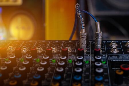 Audio sound mixer analog at the sound control room on blurred background