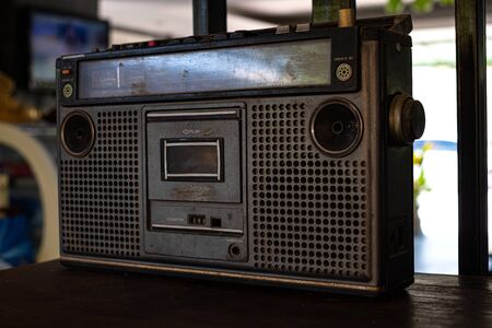 Old fashioned audio tape player on top desk wood backgroundの写真素材